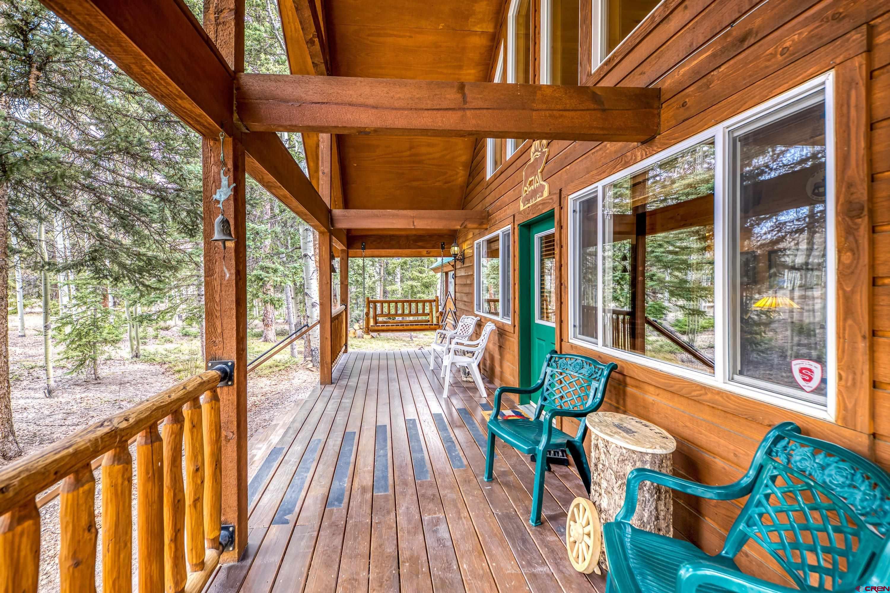 200 Lake Road Cimarron, CO 81220 - Photo 27 of 45 a view of porch with wooden floor and outdoor seating