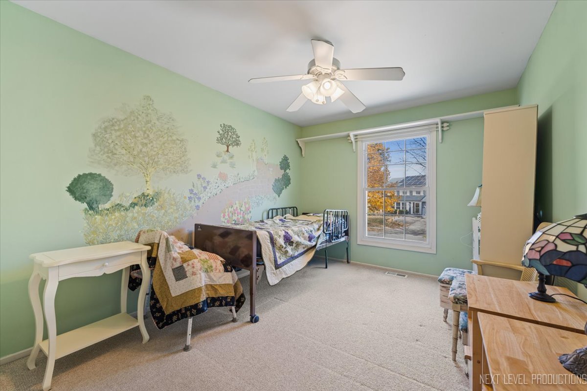 2167 Countryside Circle Naperville, IL 60565 - Photo 13 of 27 a bedroom with a bed and a window