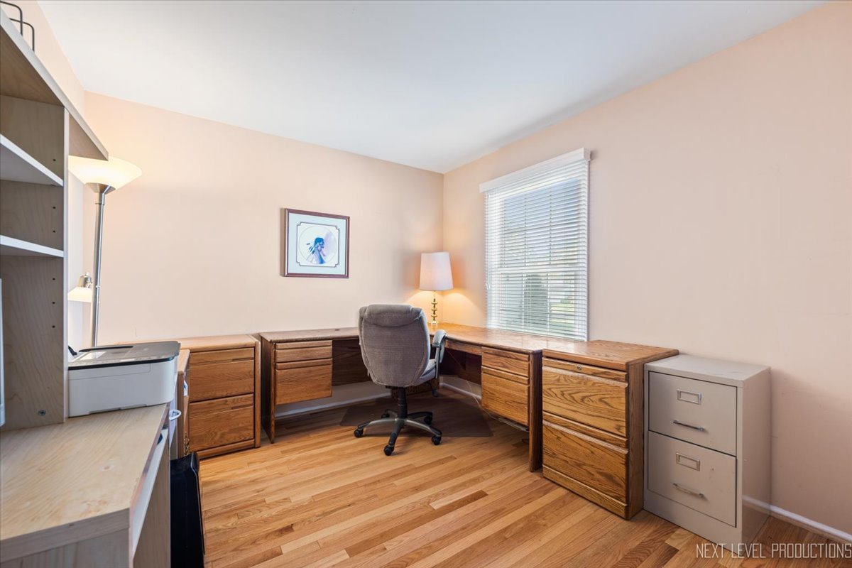 2167 Countryside Circle Naperville, IL 60565 - Photo 14 of 27 a view of a workspace with furniture and a window