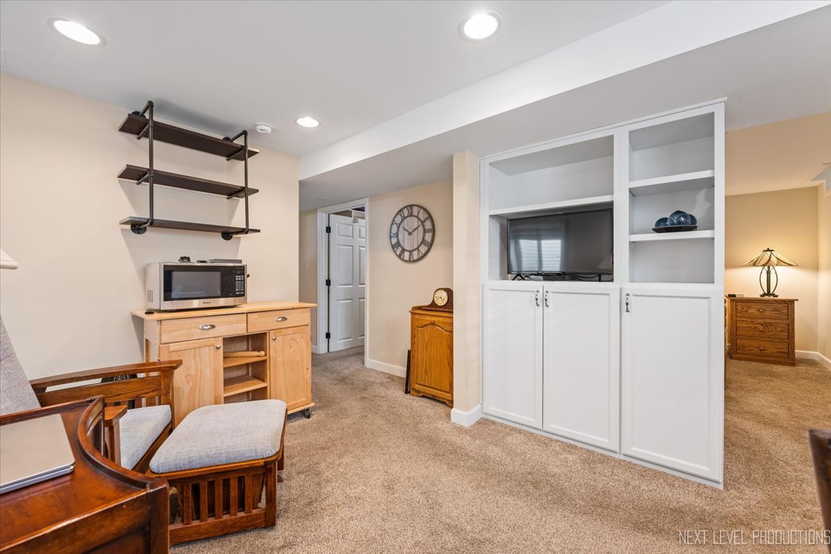 2167 Countryside Circle Naperville, IL 60565 - Photo 20 of 27 a room with furniture and wooden floor