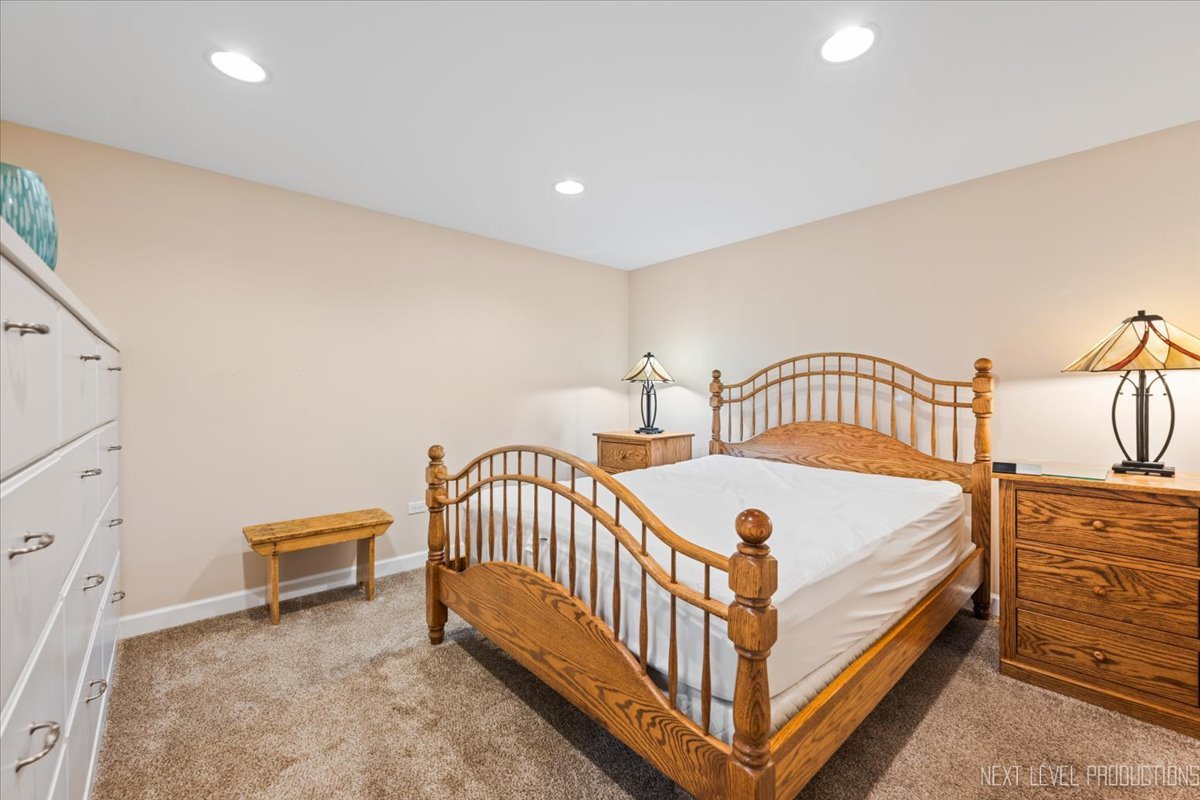 2167 Countryside Circle Naperville, IL 60565 - Photo 21 of 27 a bedroom with a bed and a dresser