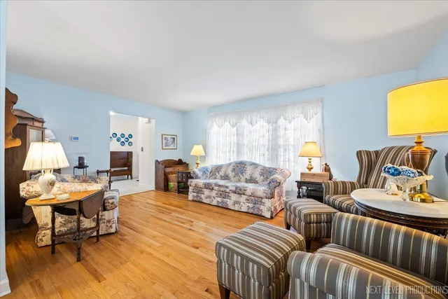 a living room with furniture and a lamp