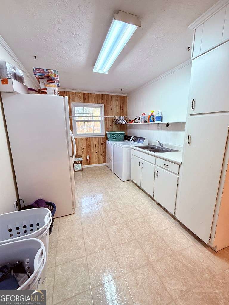 1881 Bell Telephone Road Hazlehurst, GA 31539 - Photo 16 of 71 a kitchen with a refrigerator and a stove top oven