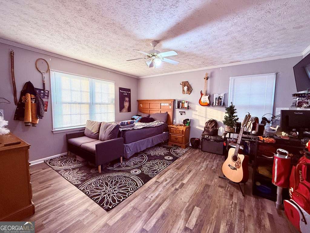 1881 Bell Telephone Road Hazlehurst, GA 31539 - Photo 36 of 71 a living room with lots of furniture and a window