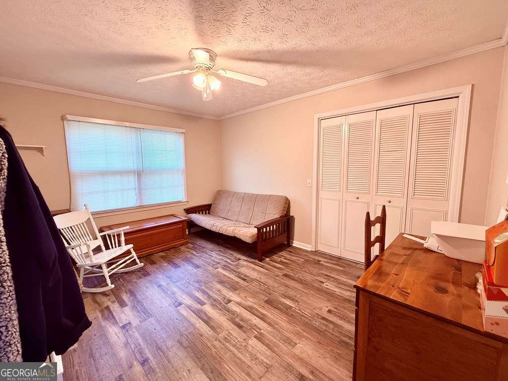 1881 Bell Telephone Road Hazlehurst, GA 31539 - Photo 38 of 71 a living room with a bed furniture and a window
