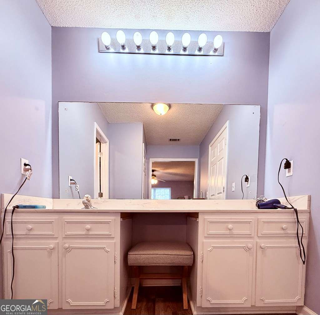 1881 Bell Telephone Road Hazlehurst, GA 31539 - Photo 39 of 71 a bathroom with a sink and a mirror