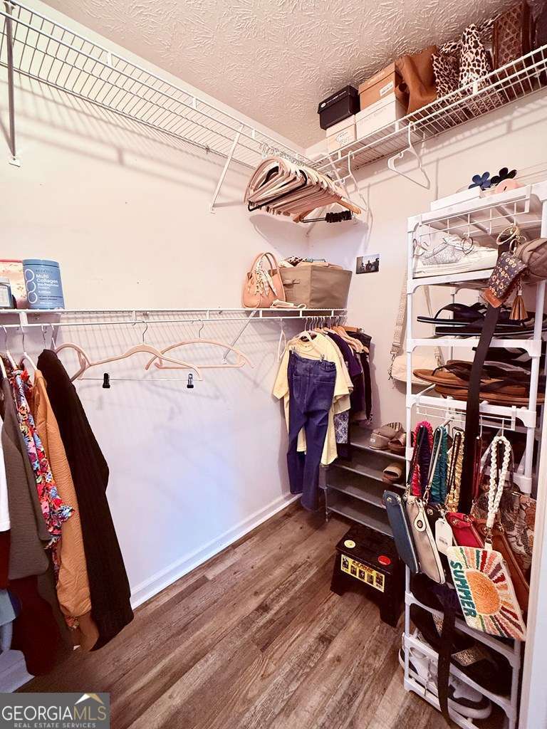 1881 Bell Telephone Road Hazlehurst, GA 31539 - Photo 40 of 71 a view of walk in closet with clothes and shoes