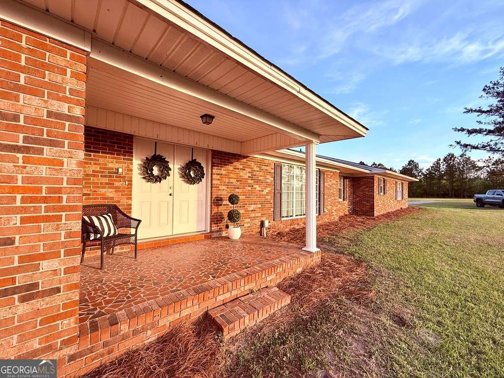 1881 Bell Telephone Road Hazlehurst, GA 31539 - Photo 4 of 71 a view of a backyard with a patio