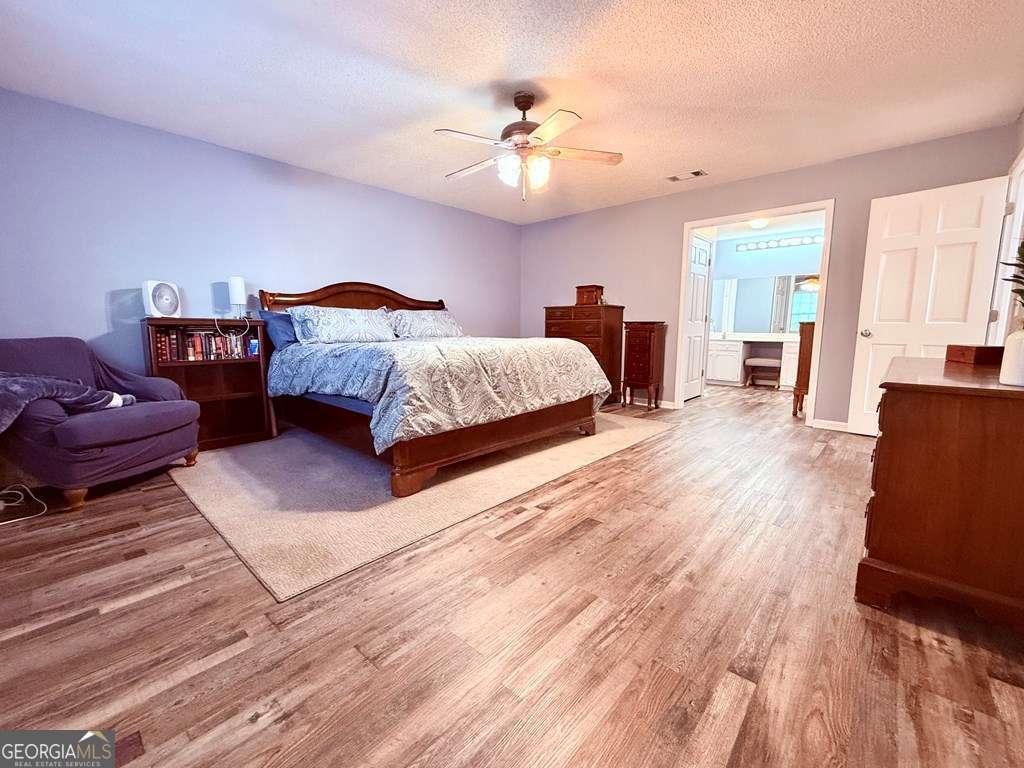 1881 Bell Telephone Road Hazlehurst, GA 31539 - Photo 43 of 71 a spacious bedroom with a bed and window