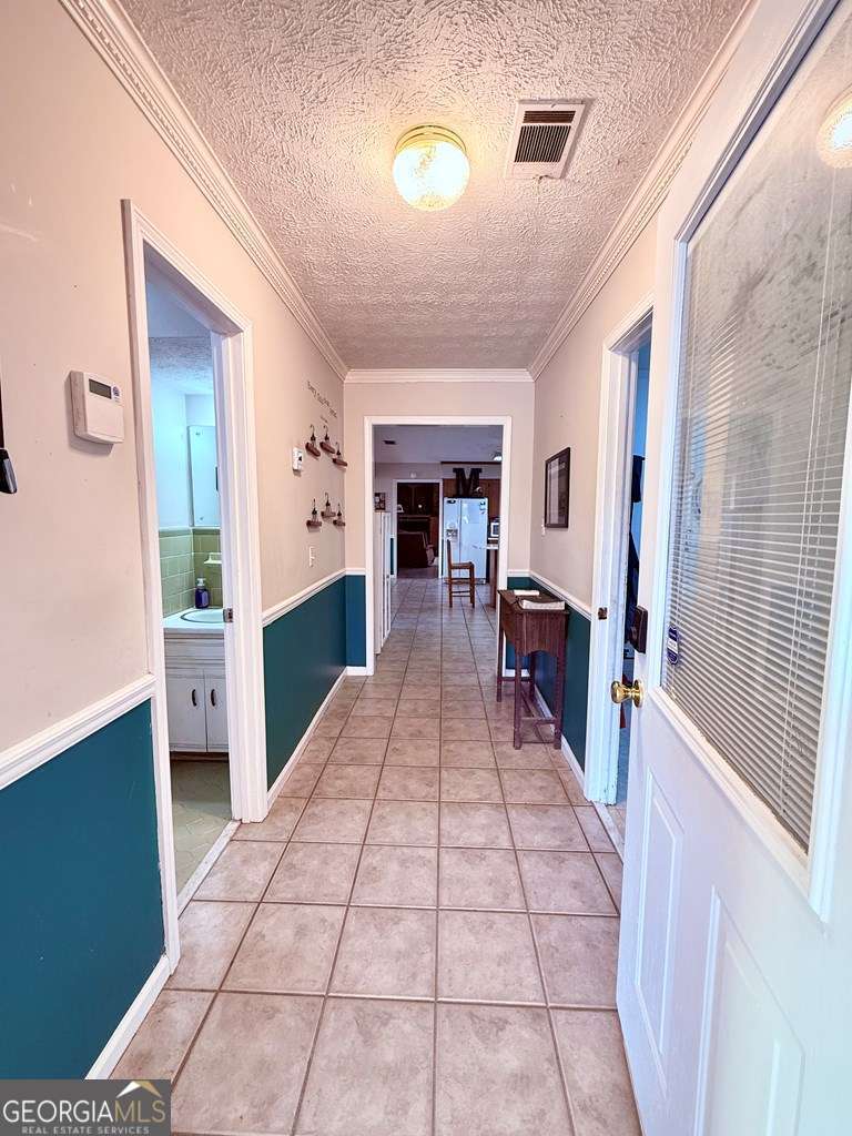 1881 Bell Telephone Road Hazlehurst, GA 31539 - Photo 10 of 71 a lobby with furniture and a fireplace