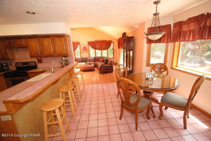 154 Bowman Road Mount Pocono, PA 18344 - Photo 11 of 41 a very nice looking dining room with a large window and chandelier