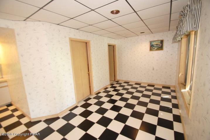 154 Bowman Road Mount Pocono, PA 18344 - Photo 32 of 41 a black and white checkered floor with a black white checkered floor