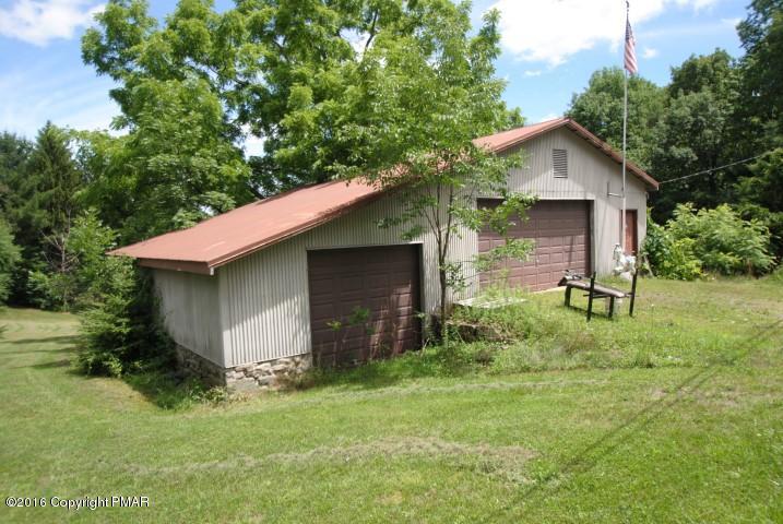 154 Bowman Road Mount Pocono, PA 18344 - Photo 38 of 41 a backyard of a house with lots of green space