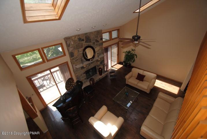 154 Bowman Road Mount Pocono, PA 18344 - Photo 5 of 41 a view of a living room with furniture and a window
