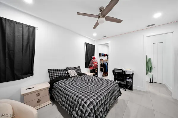 a bedroom with a bed and a dresser