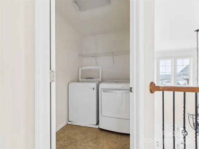 a view of storage and utility room with washer and dryer