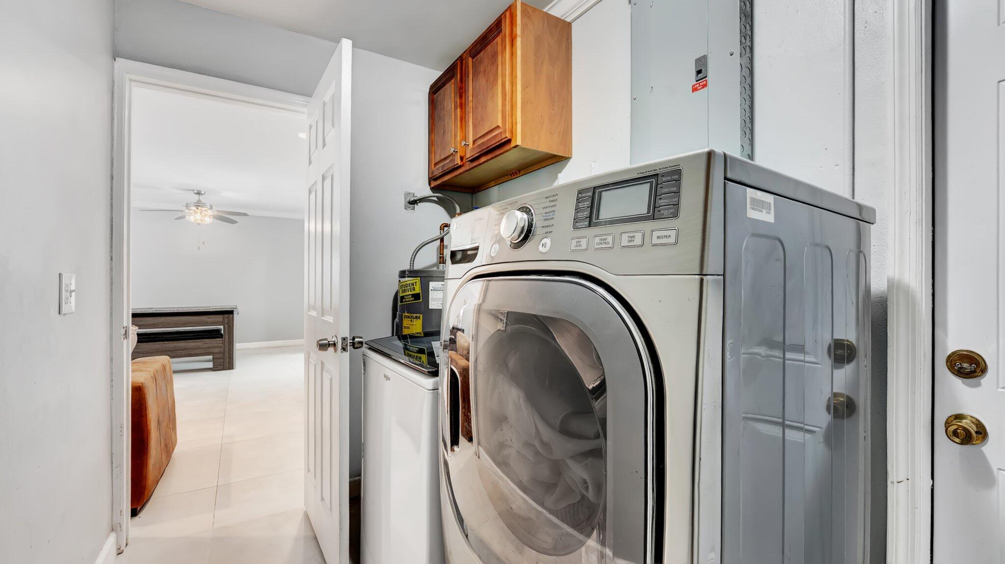 9709 Southwest 1st Place Boca Raton, FL 33428 - Photo 15 of 32 a utility room with dryer and washer