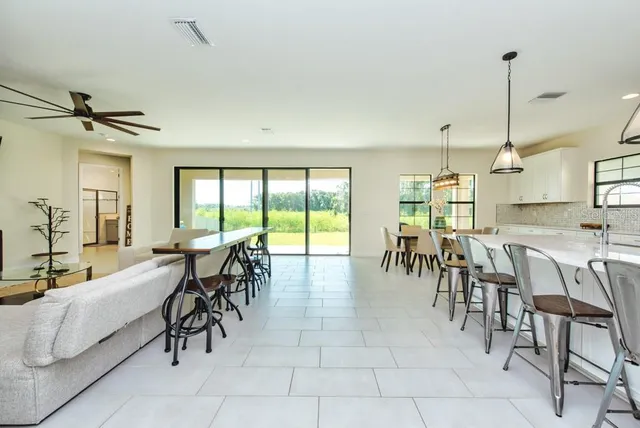 a very nice looking dining room with furniture
