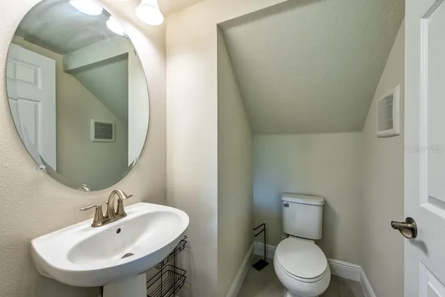 a view of hallway with a floor to ceiling window