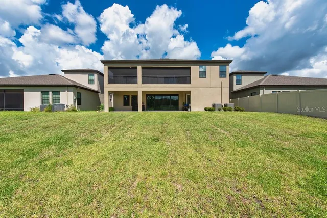 a view of a house with a big yard