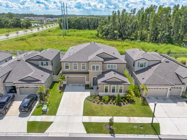 a view of a swimming pool with a yard