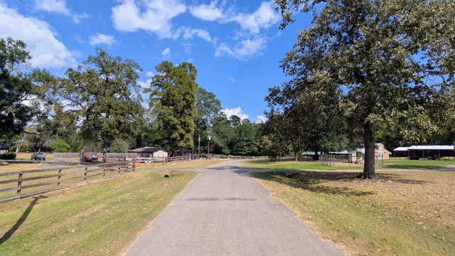 a view of a yard with swimming pool