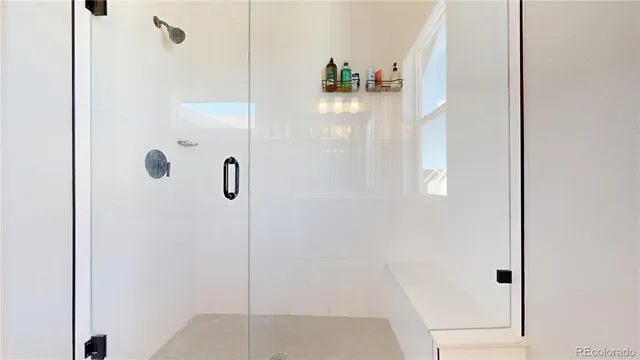 a bedroom with a bed and a potted plant