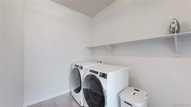 a bedroom with a bed and a potted plant