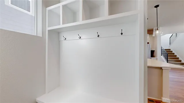 a view of an empty room with gym equipment