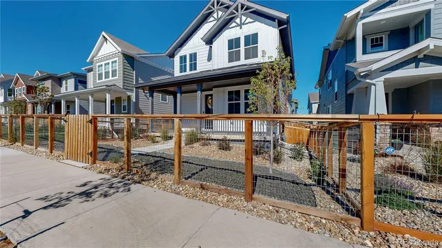 a view of a house with wooden deck