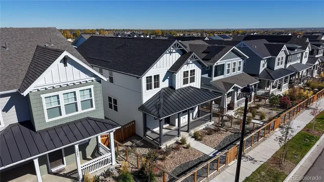 an aerial view of multiple houses with a balcony