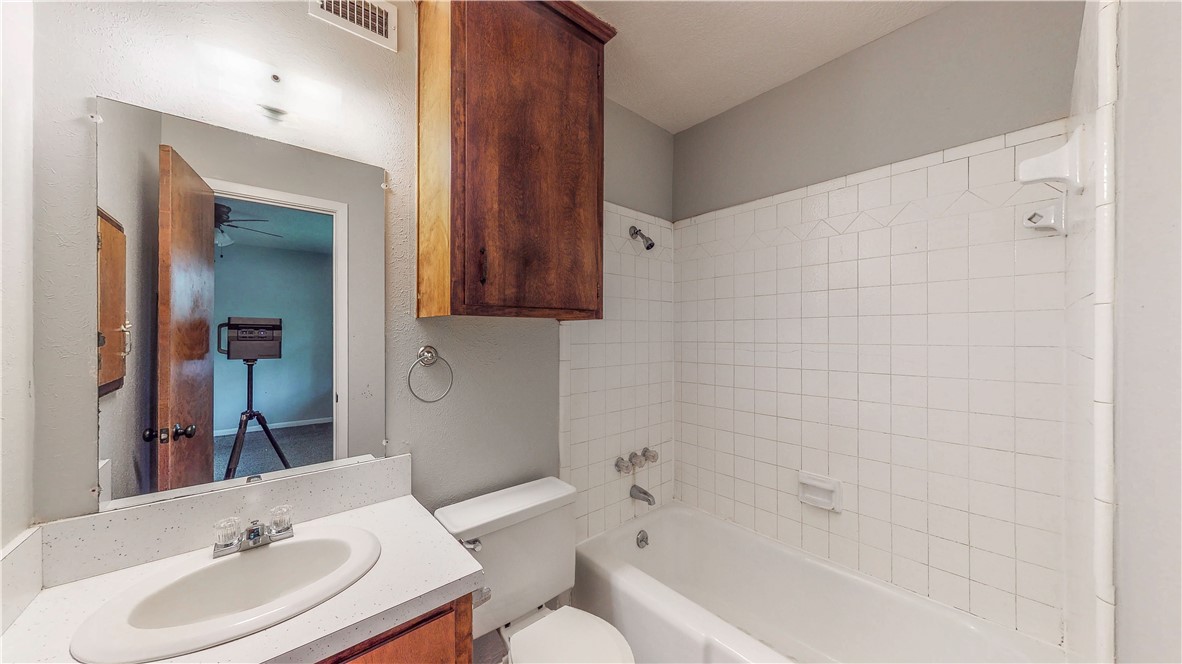 1108 Forest Glen Court Bryan, TX 77803 - Photo 20 of 26 a bathroom with a sink toilet and shower