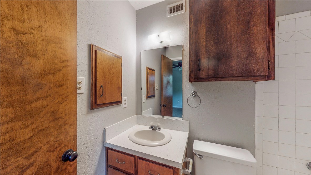 1108 Forest Glen Court Bryan, TX 77803 - Photo 21 of 26 a bathroom with a sink and a mirror