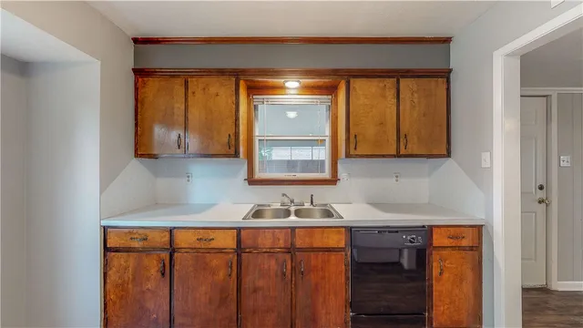 a bathroom with sink a mirror and cabinets