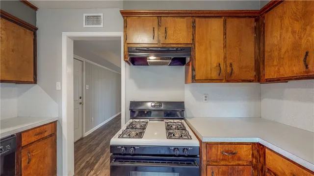 a kitchen with a stove and a microwave