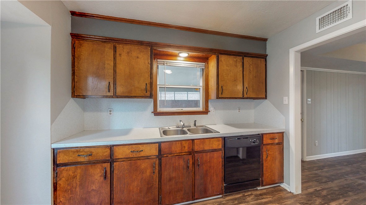 1108 Forest Glen Court Bryan, TX 77803 - Photo 7 of 26 a kitchen with stainless steel appliances granite countertop cabinets sink and window