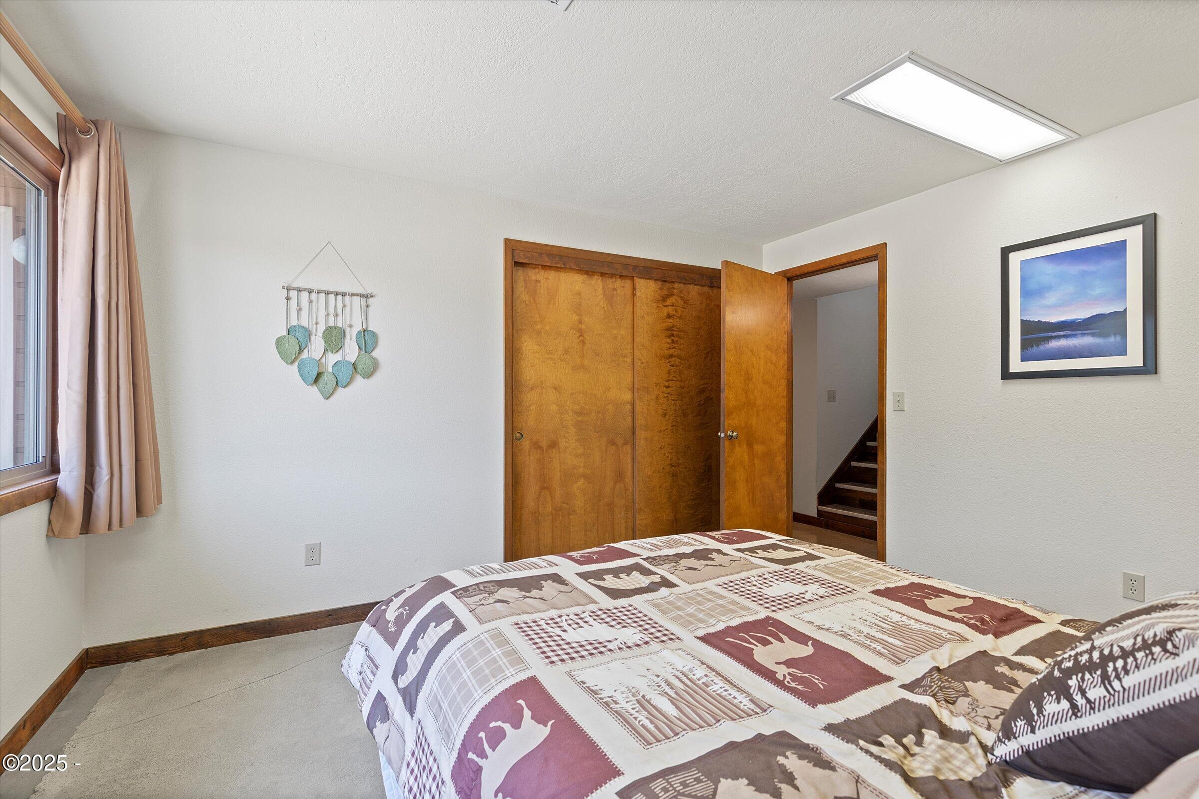 21560 Gooseneck Road Sheridan, OR 97378 - Photo 41 of 63 a bedroom with a bed and a window