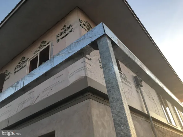 a kitchen with counter top space and windows