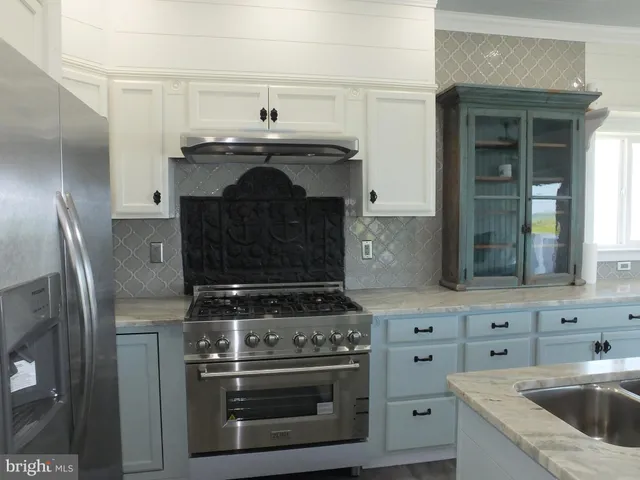 a room with a walk in closet and wooden floor