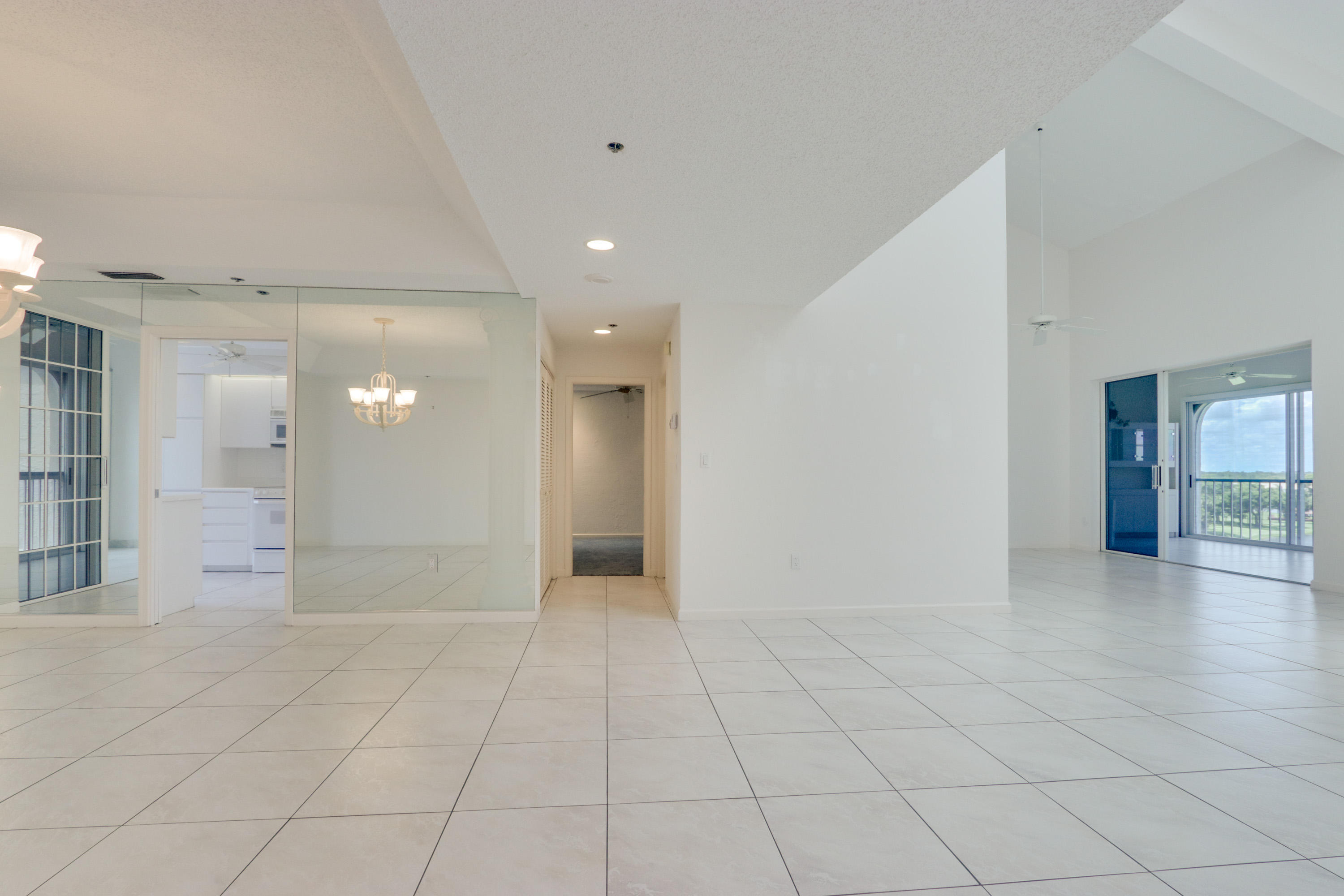 17031 Boca Club Boulevard, Unit 106A Boca Raton, FL 33487 - Photo 25 of 60 Foyer view to dining-living area