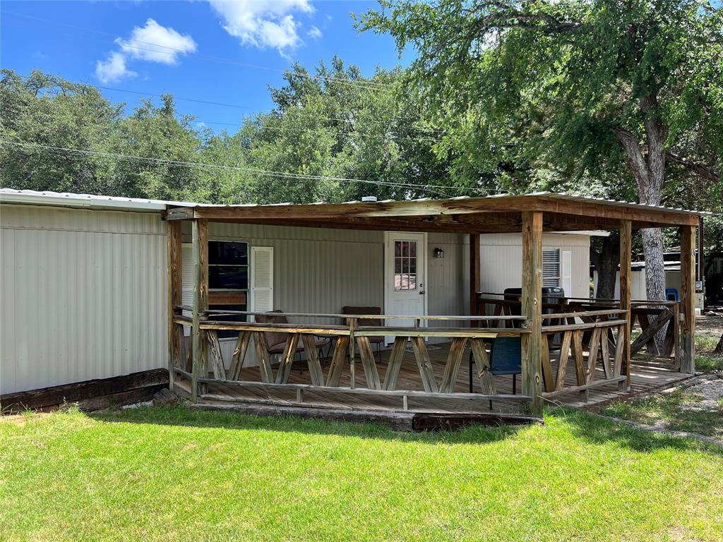 2334 San Bar Road, Unit 46 Graford, TX 76449 - Photo 2 of 37 a view of a house with a yard and sitting area