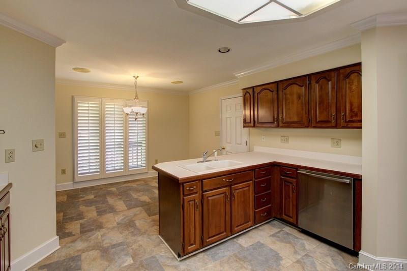 231 Manor House Mill Fort Mill, SC 29708 - Photo 14 of 17 a kitchen with a sink and cabinets