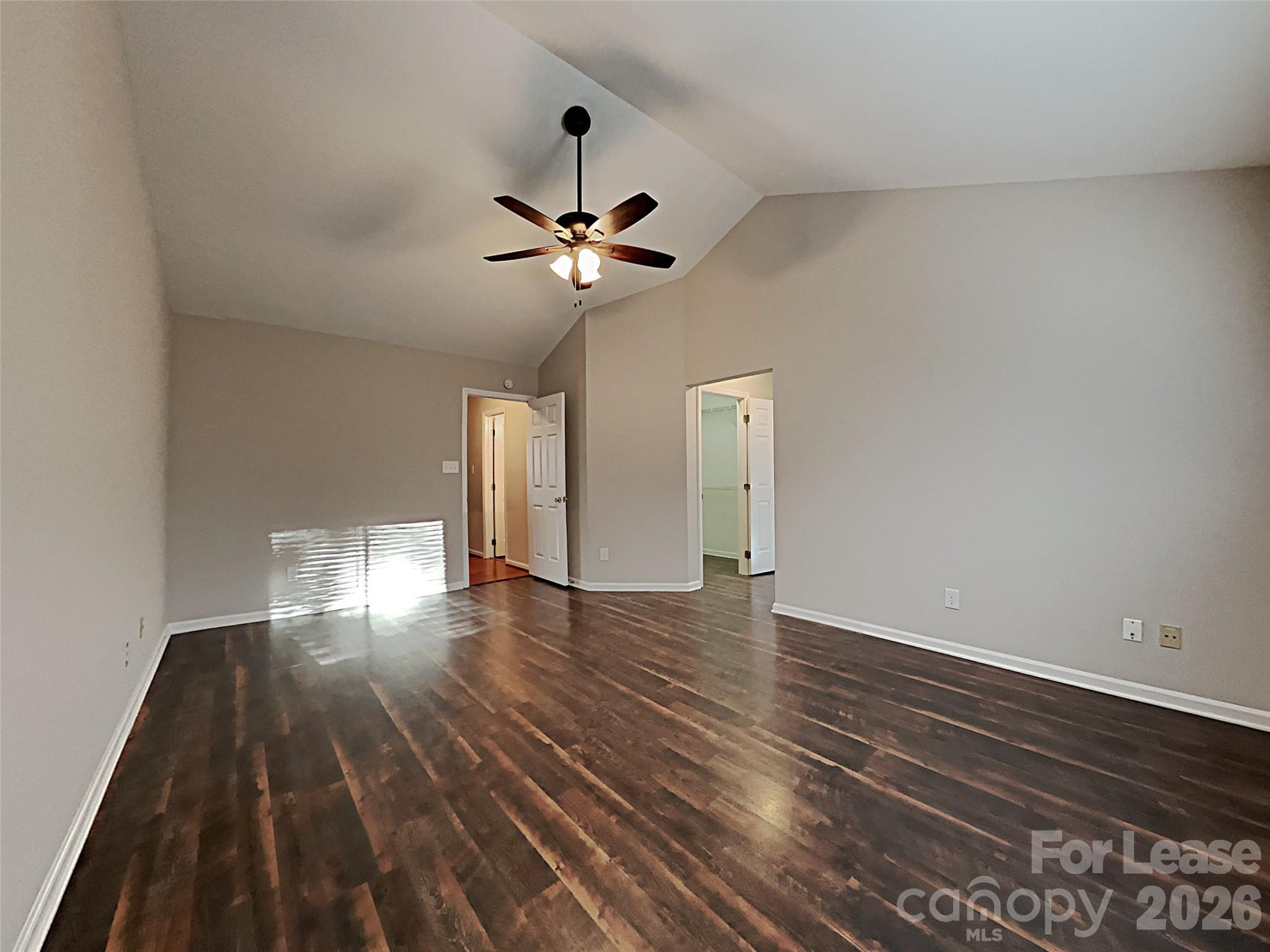 10715 Spruce Mountain Road Charlotte, NC 28214 - Photo 12 of 26 a view of empty room with wooden floor and fan