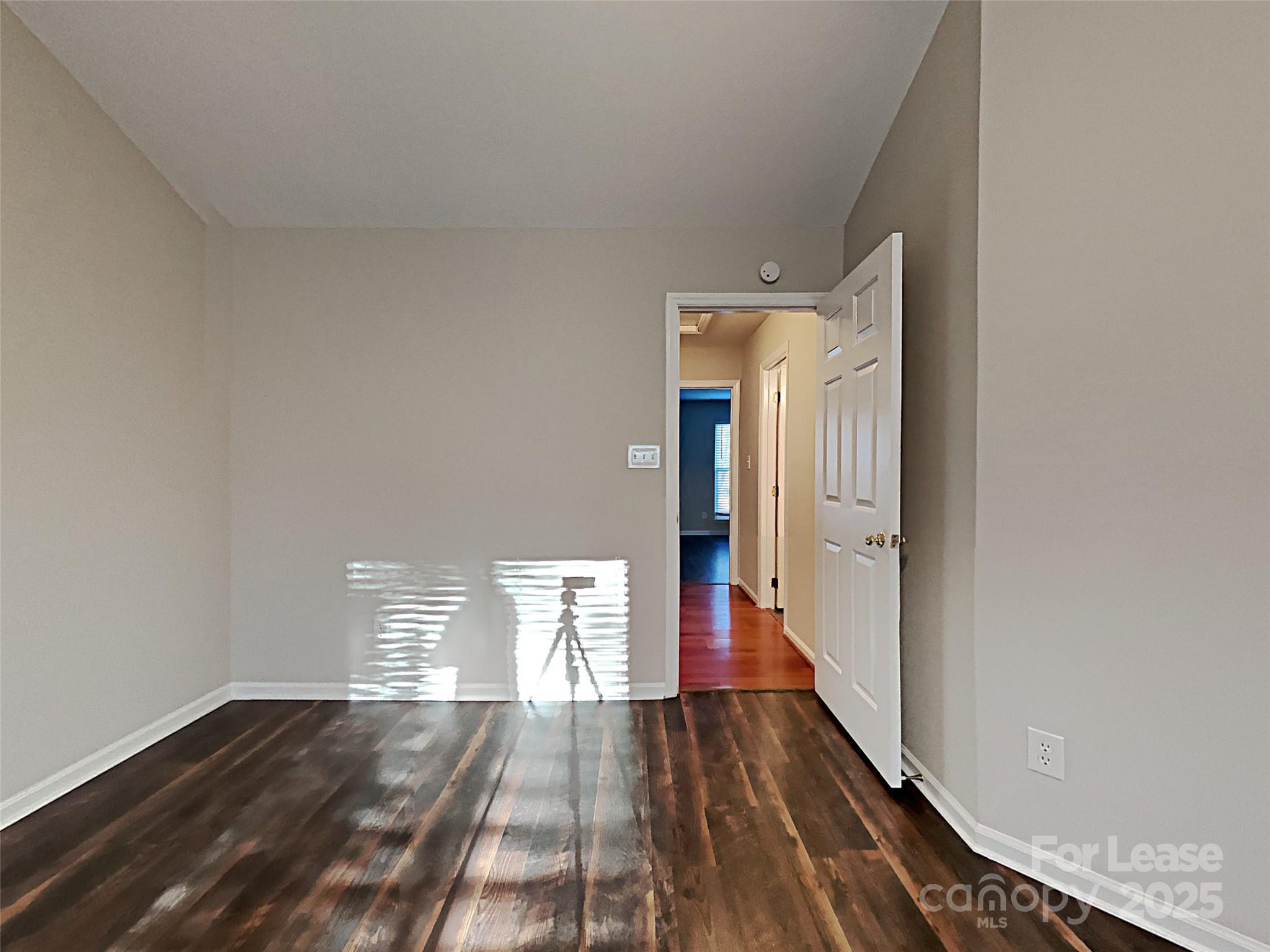 10715 Spruce Mountain Road Charlotte, NC 28214 - Photo 17 of 26 a view of empty room with wooden floor