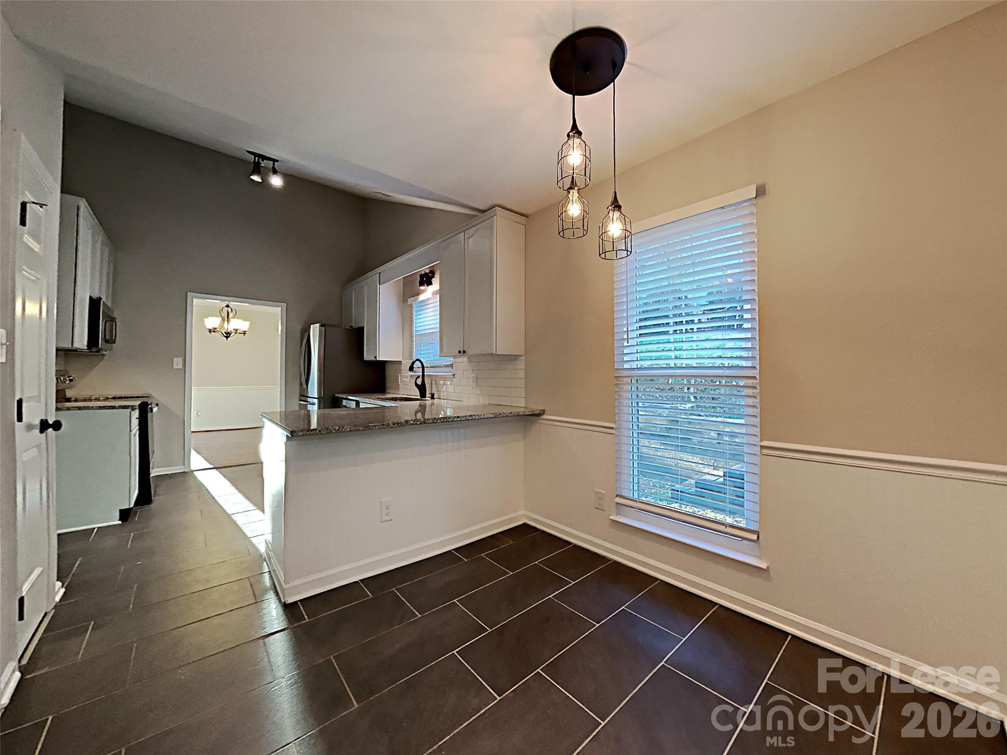 10715 Spruce Mountain Road Charlotte, NC 28214 - Photo 10 of 26 a view of an empty room and a window