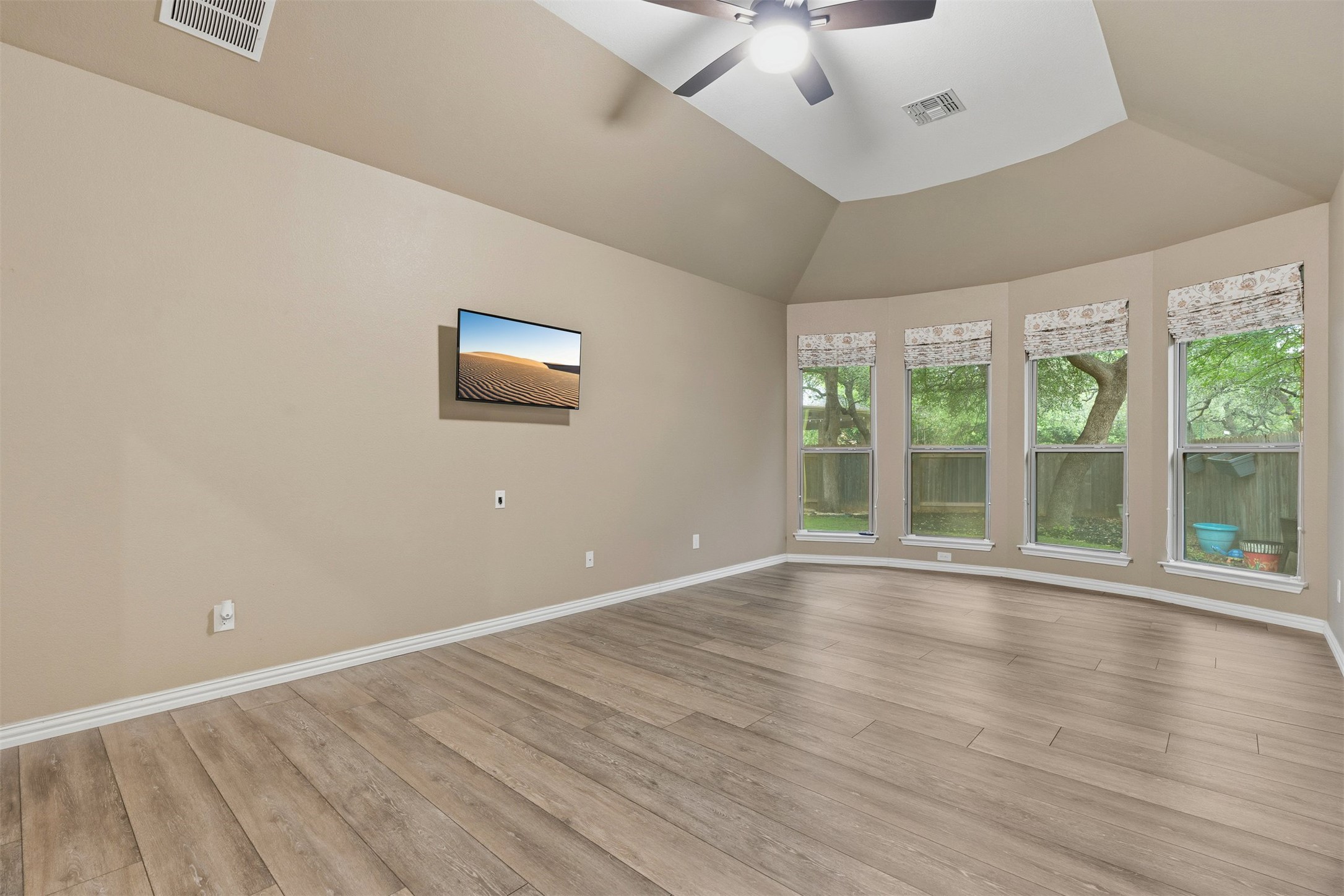 3935 Bowstring Bend Cedar Park, TX 78613 - Photo 20 of 39 Located on the main floor for privacy, the primary suite features a bay window overlooking the backyard greenery