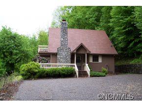 477 Rocky Top Road Maggie Valley, NC 28751 - Photo 1 of 20 a front view of a house with a yard and garage