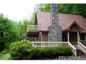 477 Rocky Top Road Maggie Valley, NC 28751 - Photo 2 of 20 a view of a house with a small yard and wooden fence