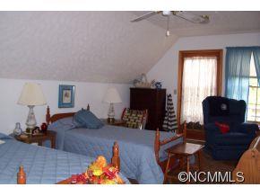 477 Rocky Top Road Maggie Valley, NC 28751 - Photo 17 of 20 a living room with furniture and a fireplace