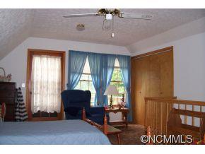 477 Rocky Top Road Maggie Valley, NC 28751 - Photo 18 of 20 a living room with furniture and a large window